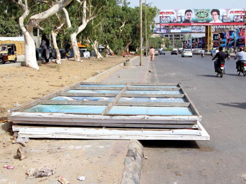 billboards taken down on sunday evening were left on main sharae quaideen leading to traffic jams during rush hours photo aysha saleem express