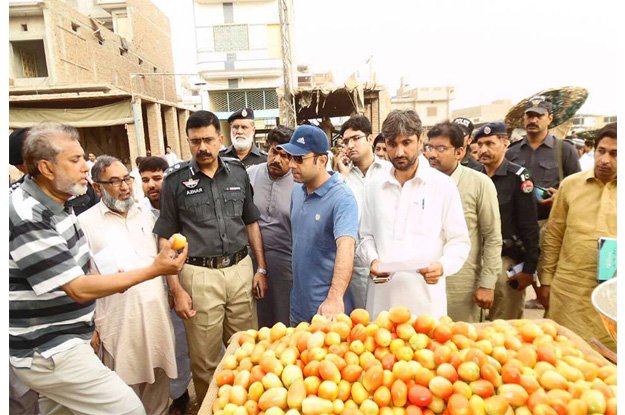 dco nadir chattha visiting one of the ramazan bazaars in the district photo online file