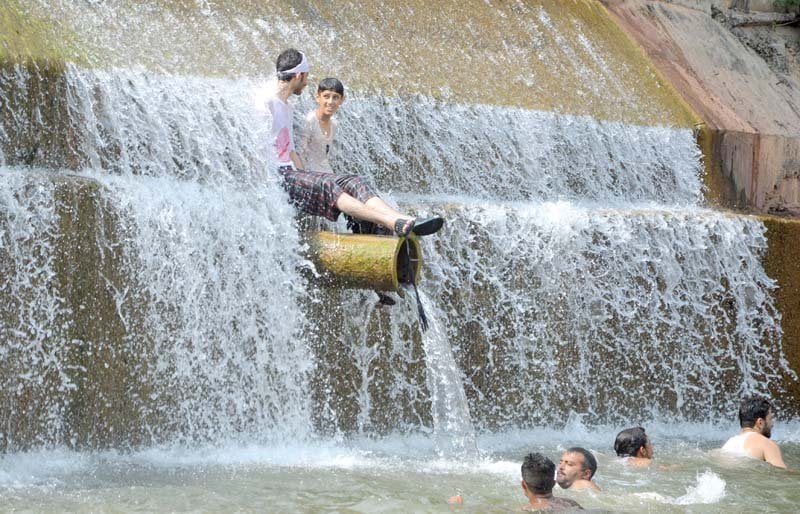 the wellbeing of children who go to dams to beat the heat at risk photos file