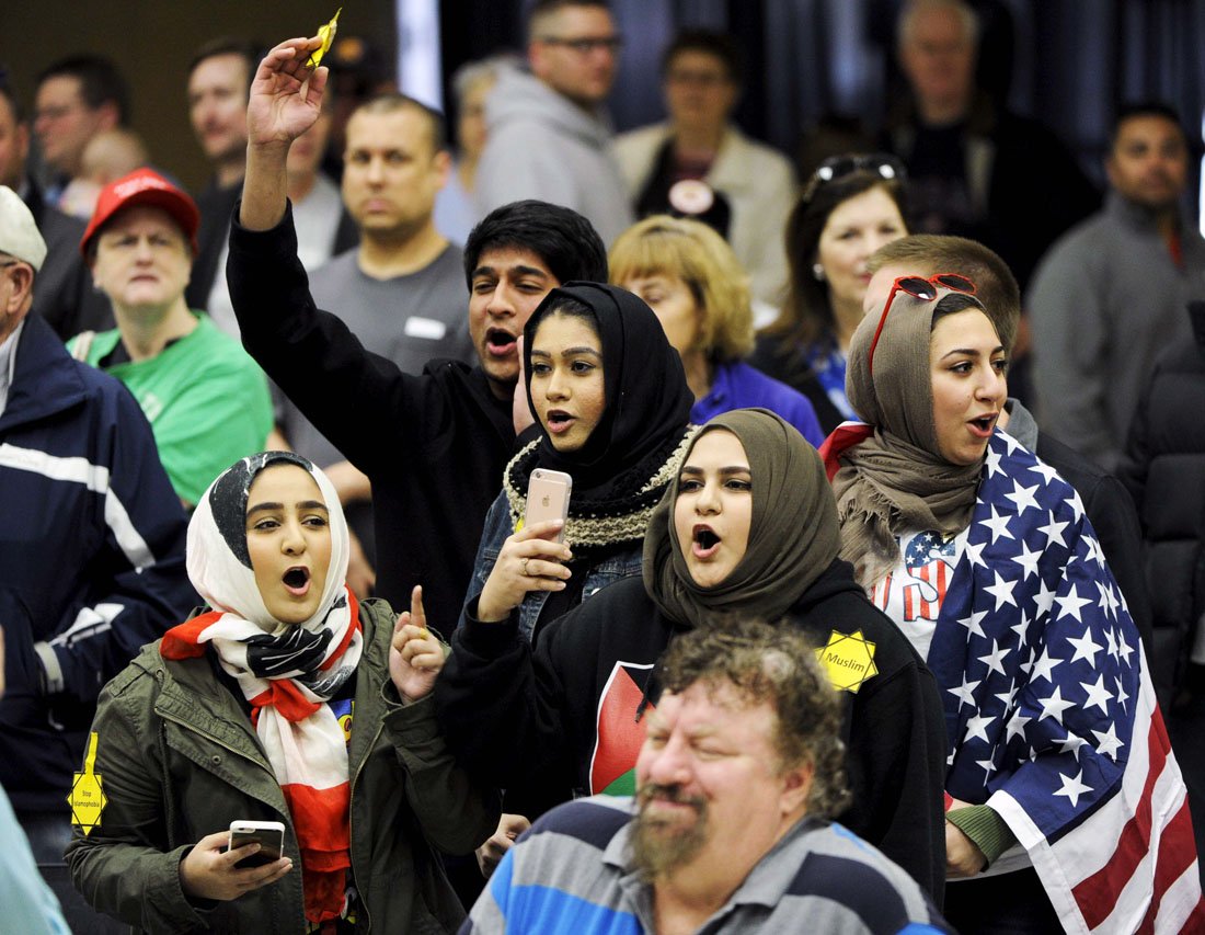 young muslims protest against us republican presidential candidate donald trump before being escorted out during a campaign rally in the kansas republican caucus at the century ii convention and entertainment center in wichita kansas march 5 2016 photo reuters