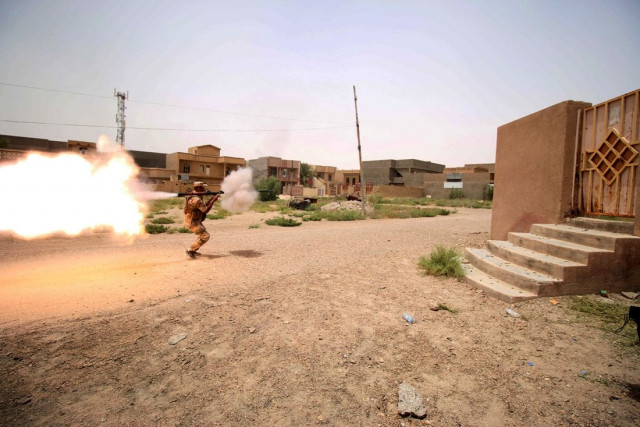 a member of the iraqi pro government forces fires a rocket propelled grenade during clashes with islamic state is group fighters as they try to enter the eastern askari neighbourhood of fallujah during a military operation to clear the city of is fighters still holed up in the former jihadi bastion on june 19 2016 photo afp a member of the iraqi pro government forces fires a rocket propelled grenade during clashes with islamic state is group fighters as they try to enter the eastern askari neighbourhood of fallujah during a military operation to clear the city of is fighters still holed up in the former jihadi bastion on june 19 2016 photo afp