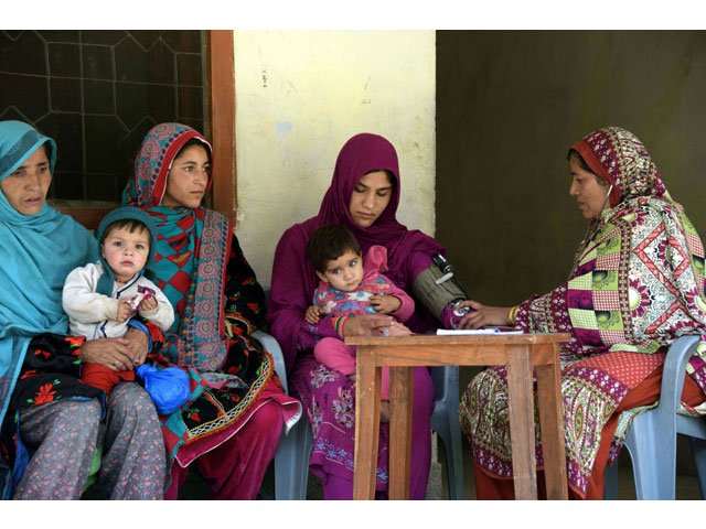 in this photograph taken on may 27 2016 health worker zeweer jan r speaks with pregnant kashmiri women at a healthcare centre in the town of sharda in the mountainous neelum valley photo afp