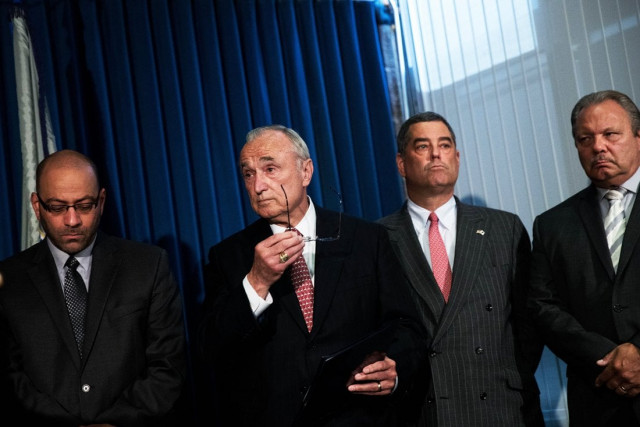 l to r george khouzami federal bureau of investigation assistant special agent in charge william 039 bill 039 bratton commissioner of the new york city police department and members of the nypd look on during a press conference announcing corruption charges against members the new york city police department photo afp l to r george khouzami federal bureau of investigation assistant special agent in charge william 039 bill 039 bratton commissioner of the new york city police department and members of the nypd look on during a press conference announcing corruption charges against members the new york city police department photo afp