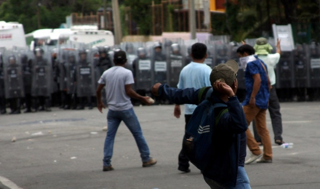 teachers clash with mexican federal police in oaxaca on june 20 2016 thousands of teachers protested in southern mexico on monday to denounce the deaths of eight people after violent weekend clashes that police blamed on unidentified gunmen photo afp teachers clash with mexican federal police in oaxaca on june 20 2016 thousands of teachers protested in southern mexico on monday to denounce the deaths of eight people after violent weekend clashes that police blamed on unidentified gunmen photo afp