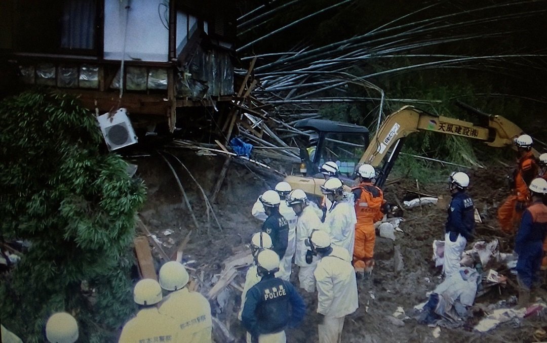 police officers and firefighters during rescue operations following a landslide in the southern japanese city of kumamoto photo afp