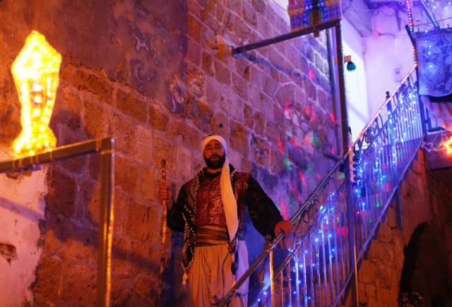 michel ayoub an arab israeli christian man carrying out the role of a quot musaharati quot the traditional figure who awakens muslims for the quot suhur quot the pre dawn traditional meal before muslims start their fast during the sacred month of ramadan walks in the street rousing muslim residents in the northern israeli port city of acre on june 16 2016 photo afp michel ayoub an arab israeli christian man carrying out the role of a quot musaharati quot the traditional figure who awakens muslims for the quot suhur quot the pre dawn traditional meal before muslims start their fast during the sacred month of ramadan walks in the street rousing muslim residents in the northern israeli port city of acre on june 16 2016 photo afp
