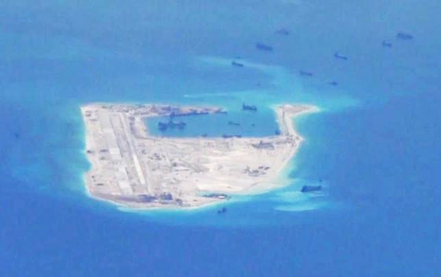 chinese dredging vessels are purportedly seen in the waters around fiery cross reef in the disputed spratly islands in the south china sea in this still image from video taken by a p 8a poseidon surveillance aircraft provided by the united states navy may 21 2015 us navy handout via reuters