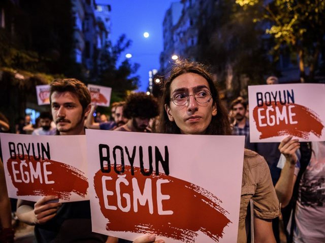 protesters hold placards reading quot no submission quot on june 18 2016 at cihangir district in istanbul during a demonstration against the islamist attack photo afp