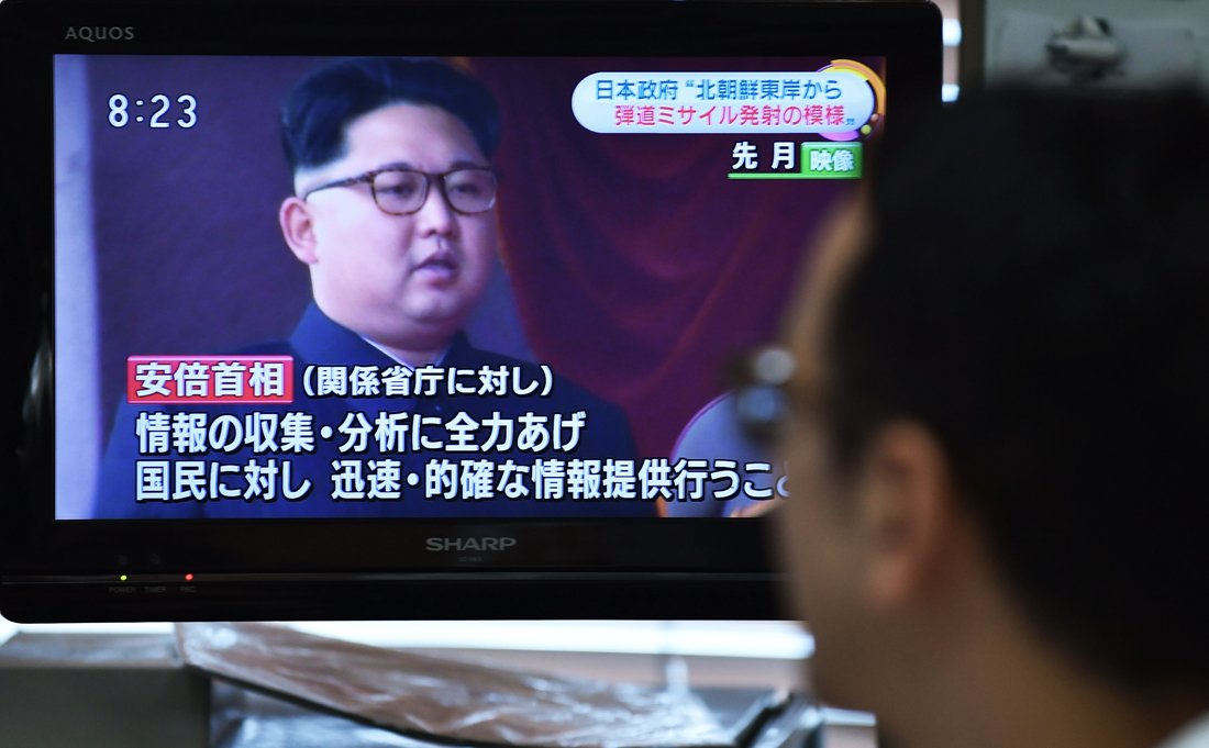 a man looks at a television reporting on north korea 039 s missile launching in tokyo on june 22 2016 photo afp