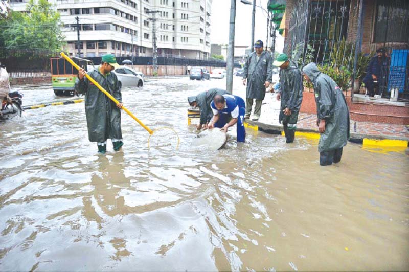 wasa workers drain rainwater from a road photo app