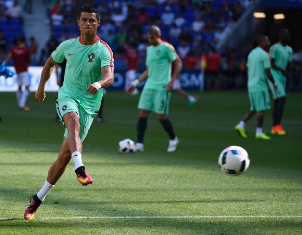 portugal 039 s forward cristiano ronaldo warms up prior to the euro 2016 group f football match between hungary and portugal at the parc olympique lyonnais stadium in decines charpieu near lyon on june 22 2016 photo afp portugal 039 s forward cristiano ronaldo warms up prior to the euro 2016 group f football match between hungary and portugal at the parc olympique lyonnais stadium in decines charpieu near lyon on june 22 2016 photo afp