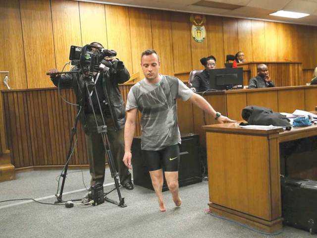 paralympic athlete oscar pistorius walks in the courtroom without his prosthetic legs during his resentencing hearing photo afp