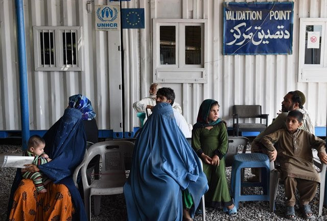 afghan refugees wait at the unhcr registration center in peshawar on june 23 2016 photo afp afghan refugees wait at the unhcr registration center in peshawar on june 23 2016 photo afp