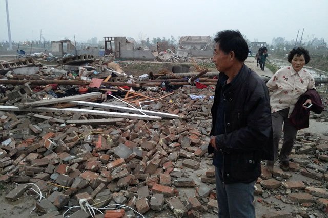 a man stands on debris of houses after a tornado hit funing county yancheng jiangsu province june 23 2016 photo reuters