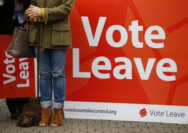 a supporter stands by a sign at the launch of the vote leave bus campaign in favour of britain leaving the european union in truro britain may 11 2016 photo reuters a supporter stands by a sign at the launch of the vote leave bus campaign in favour of britain leaving the european union in truro britain may 11 2016 photo reuters