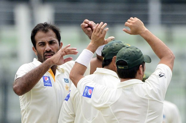 wahab riaz l celebrates with teammates at the shere bangla national cricket stadium in dhaka on may 8 2015 photo afp