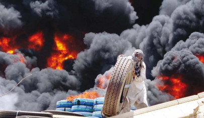 three factories engulfed in flames