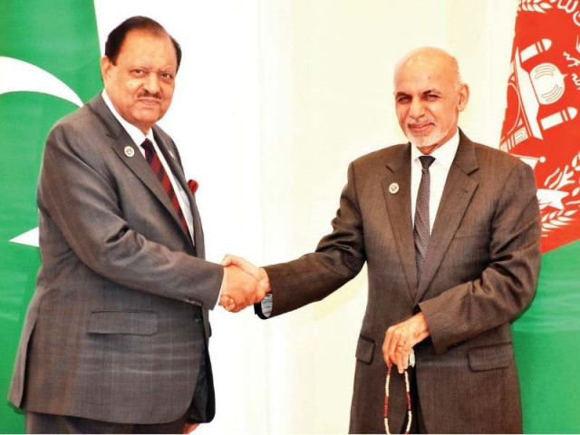 president mamnoon shakes hands with ashraf ghani at sco summit sidelines photo inp