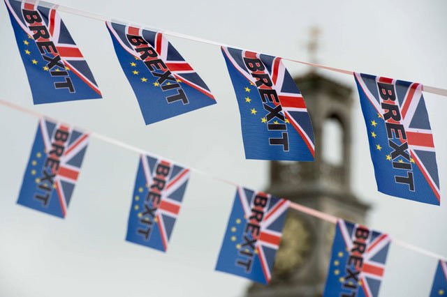 this file photo taken on june 13 2016 shows pro brexit depicting a union flag merged with the eu flag fly from a fishing boat moored in ramsgate south est england photo afp