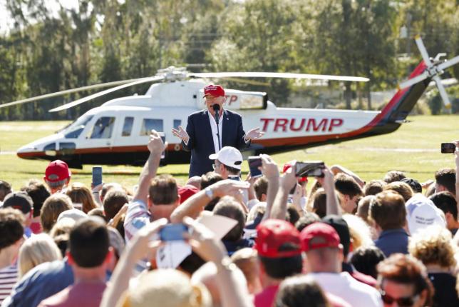 a mexican flag waved in the breeze close by as trump touched down on a golf course green in a helicopter photo reuters