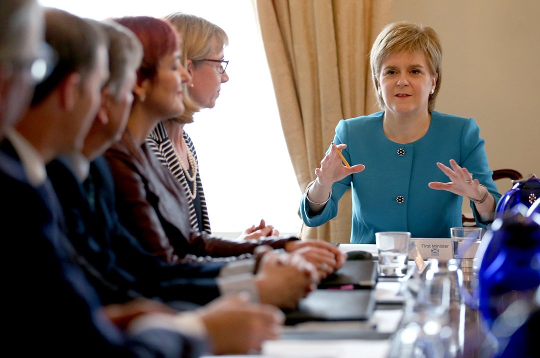 scotland 039 s first minister and leader of the scottish national party snp nicola sturgeon r chairs an emergency cabinet meeting at bute house in edinburgh photo afp