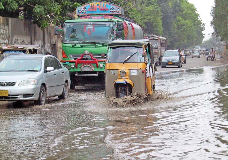 vehicles wade through water that accumulated at garden road after it rained in 2014 photo file