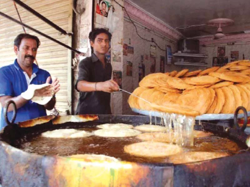 vendors preparing traditional delicacy pheni in rawalpindi photo file vendors preparing traditional delicacy pheni in rawalpindi photo file