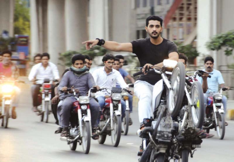 youth enjoy a wheelie in rawalpindi on sunday photo ppi