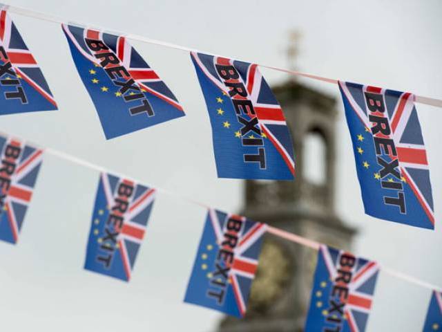 this file photo taken on june 13 2016 shows pro brexit depicting a union flag merged with the eu flag fly from a fishing boat moored in ramsgate south est england photo afp