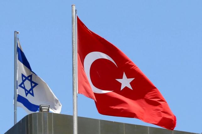 a turkish flag flutters atop the turkish embassy as an israeli flag is seen nearby in tel aviv israel june 26 2016 photo reuters