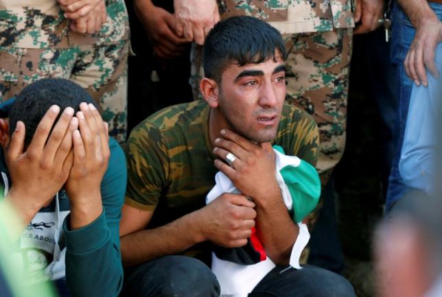 brothers of belal al zuhbe one of the solders killed in an attack on a border military post near a camp for syrian refugees cry during al zuhbe 039 s funeral at nahleh village in the city of jerash north of amman jordan june 21 2016 photo reuters