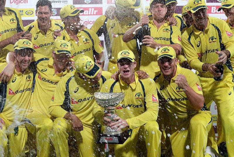 australian cricketers pose with their winning trophy in bridgetown on june 26 2016 photo afp