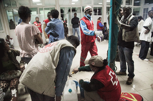 wounded people sit at the university hospital of antananarivo hjra to receive first aid after a bomb blast around 7 30 pm local time at mahamasina stadium during malagasy independence day causing 84 wounded and 2 dead on june 26 2016 photo afp