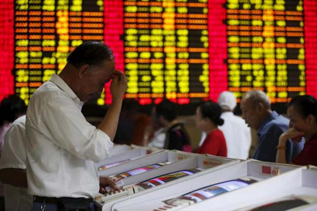 investors look at computer screens showing stock information at a brokerage house in shanghai china july 8 2015 photo reuters