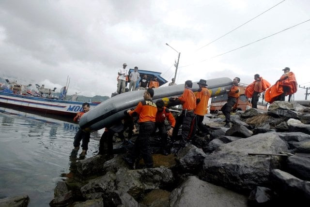 members of a search and rescue team prepare to look for victims of a shinking boat in watulimo on december 19 2011 photo afp