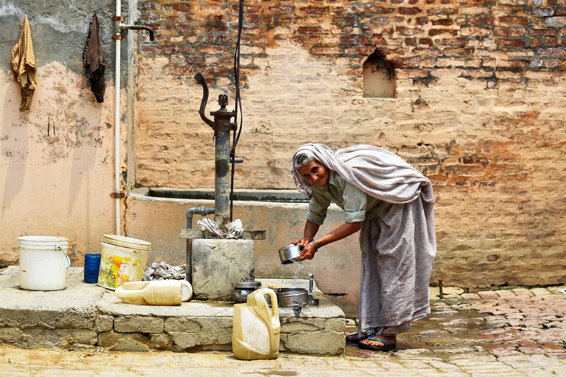 in this photograph taken on may 8 2016 an eldeerly indian villager washes utensils with contaminated water at a borewell in the village of gangnauli in the northern state of uttar pradesh photo afp