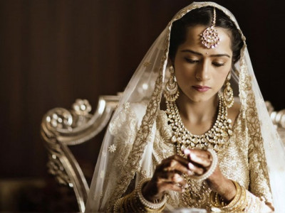 bride stitched love story onto lehnga and the result was stunning