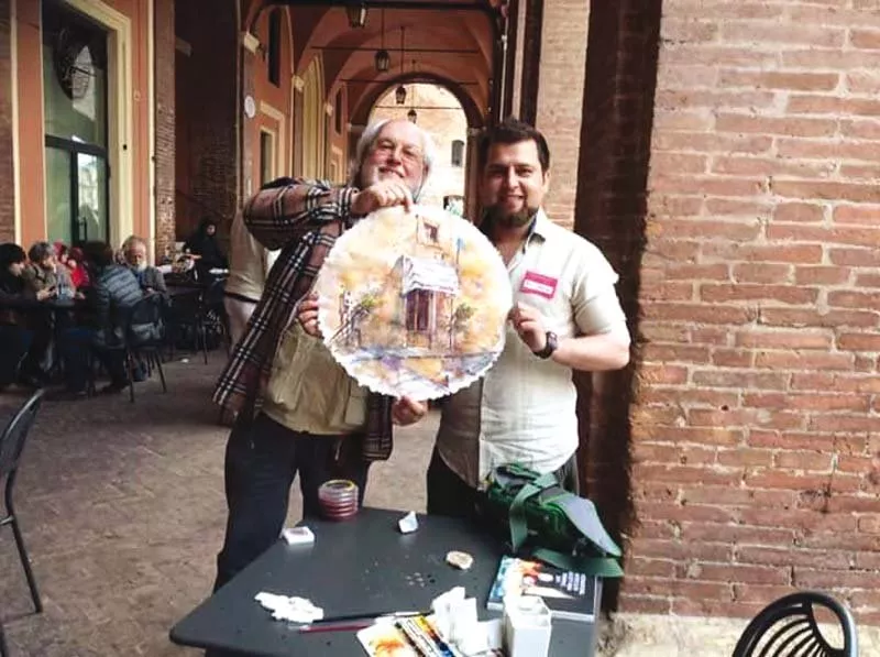 the artist displays one of his paintings photo express the artist displays one of his paintings photo express