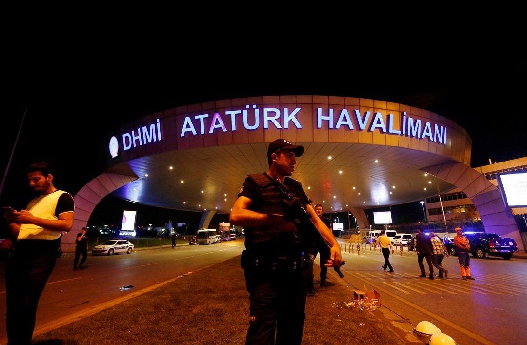 a riot police officer stands guard at the entrance of the ataturk airport in istanbul turkey following a multiple suicide bombing photo reuters