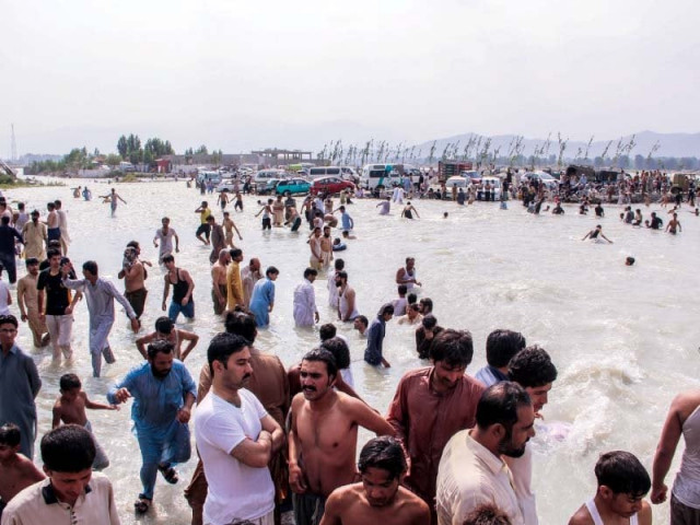 people gather at swat river photo express people gather at swat river photo express