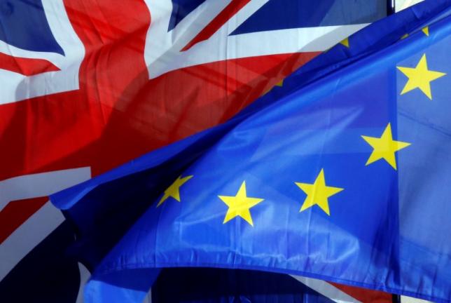 a british union jack flag and an european flag fly on the amiens city hall during a a franco britain summit in amiens northern france march 3 2016 photo reuters