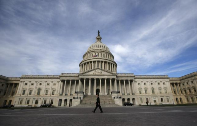 a lone worker passes by the us capitol building in washington october 8 2013 a few faint glimmers of hope surfaced in the u s fiscal standoff both in congress and at the white house with president barack obama saying he would accept a short term increase in the nation 039 s borrowing authority to avoid a default photo reuters