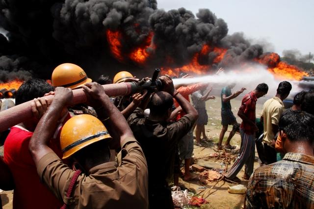 firefighters try to extinguish a fire on huge pipes in ambattur chennai india photo reuters