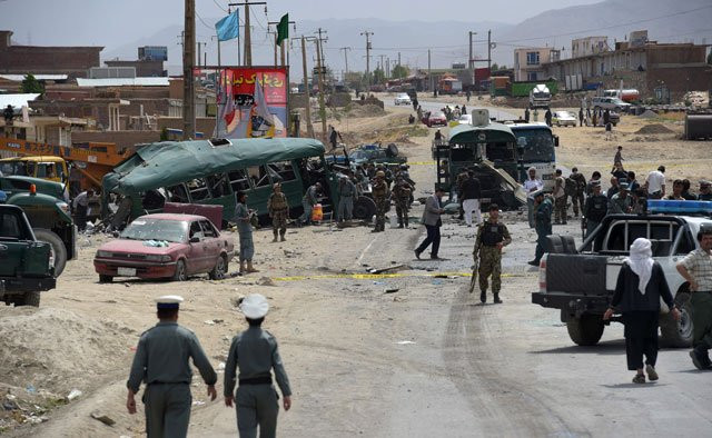 afghan security personnel gather near the wreckage of buses which were carrying police cadets at the site of a bomb attack on the outskirts of kabul on june 30 2016 photo afp afghan security personnel gather near the wreckage of buses which were carrying police cadets at the site of a bomb attack on the outskirts of kabul on june 30 2016 photo afp