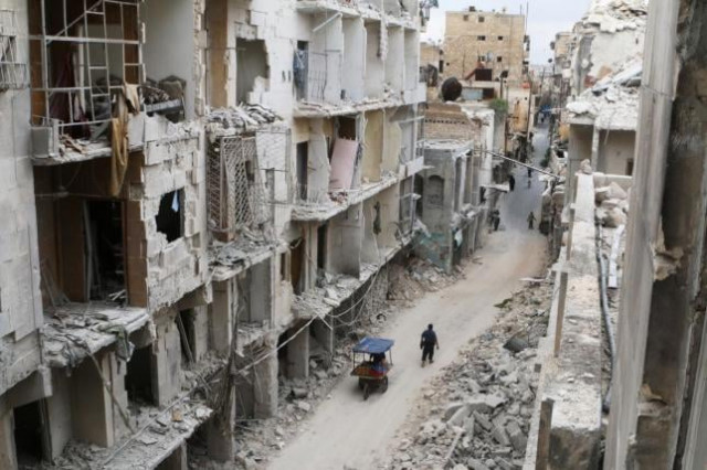 residents walk near damaged buildings in the rebel held area of old aleppo syria may 5 2016 photo reuters residents walk near damaged buildings in the rebel held area of old aleppo syria may 5 2016 photo reuters