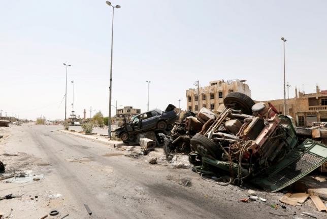 destroyed vehicles from clashes are seen in falluja iraq after government forces recaptured the city from islamic state militants june 30 2016 photo reuters