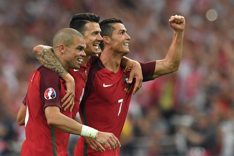 portugal 039 s pepe fonte and cristiano ronaldo celebrate after winning the euro 2016 quarter final football against poland at the stade velodrome in marseille on june 30 2016 photo afp