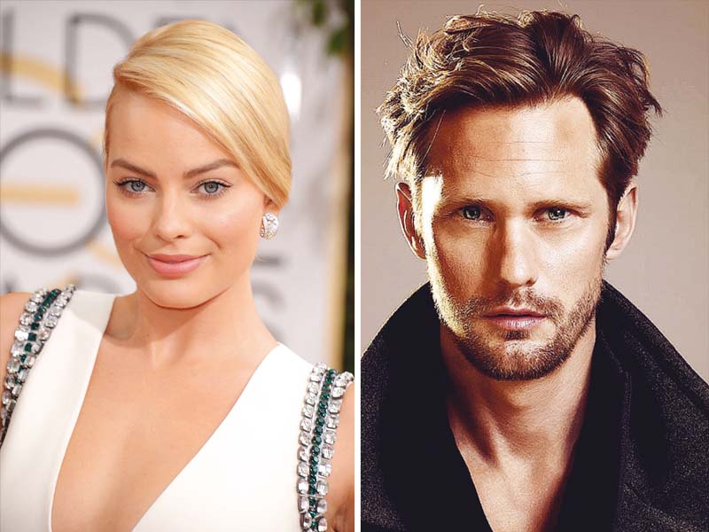 film stars margot robbie and alexander skarsgard in titular roles photos file