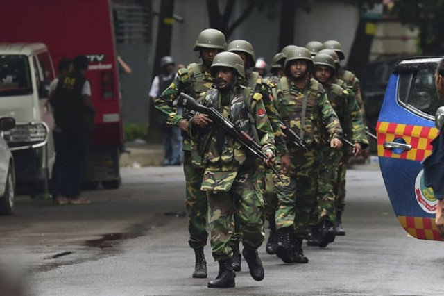 bangladeshi army soldiers patrol a street during a rescue operation as gunmen take position in a restaurant in the dhaka s high security diplomatic district on july 2 2016 photo afp bangladeshi army soldiers patrol a street during a rescue operation as gunmen take position in a restaurant in the dhaka s high security diplomatic district on july 2 2016 photo afp