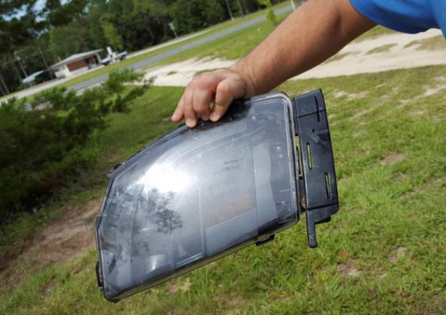 robert vankavelaar shows a piece of the tesla found in his property where the tesla came to rest when its driver was killed in a collision with a truck in may in williston florida u s july 1 2016 photo reuters